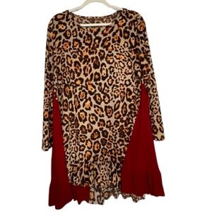 Striking women’s plus size top no label. P2P: 23.6” Length- Front: 33”Back: 35”